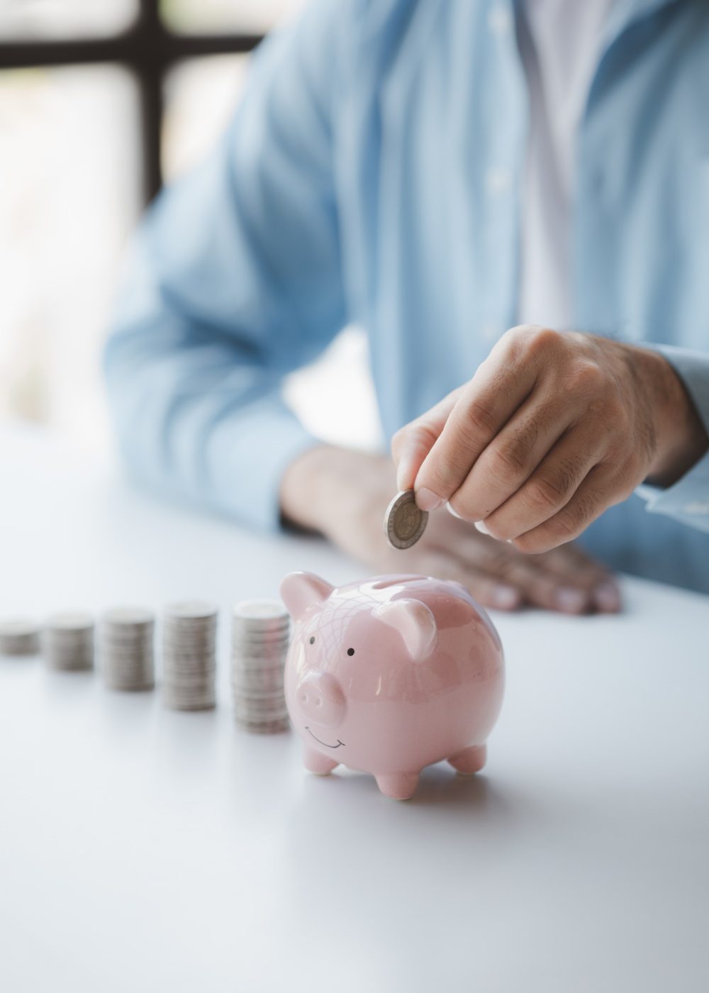 person-with-pile-of-coins-and-piggy-bank-money-saving-concept-for-future-use-and-financial-stabilit.jpg person-with-pile-of-coins-and-piggy-bank-money-saving-concept-for-future-use-and-financial-stabilit.jpg